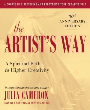 Cover The Artists Way by Julia Cameron. Red text against a golden background with a conical mountain and a line of pelicans flying.